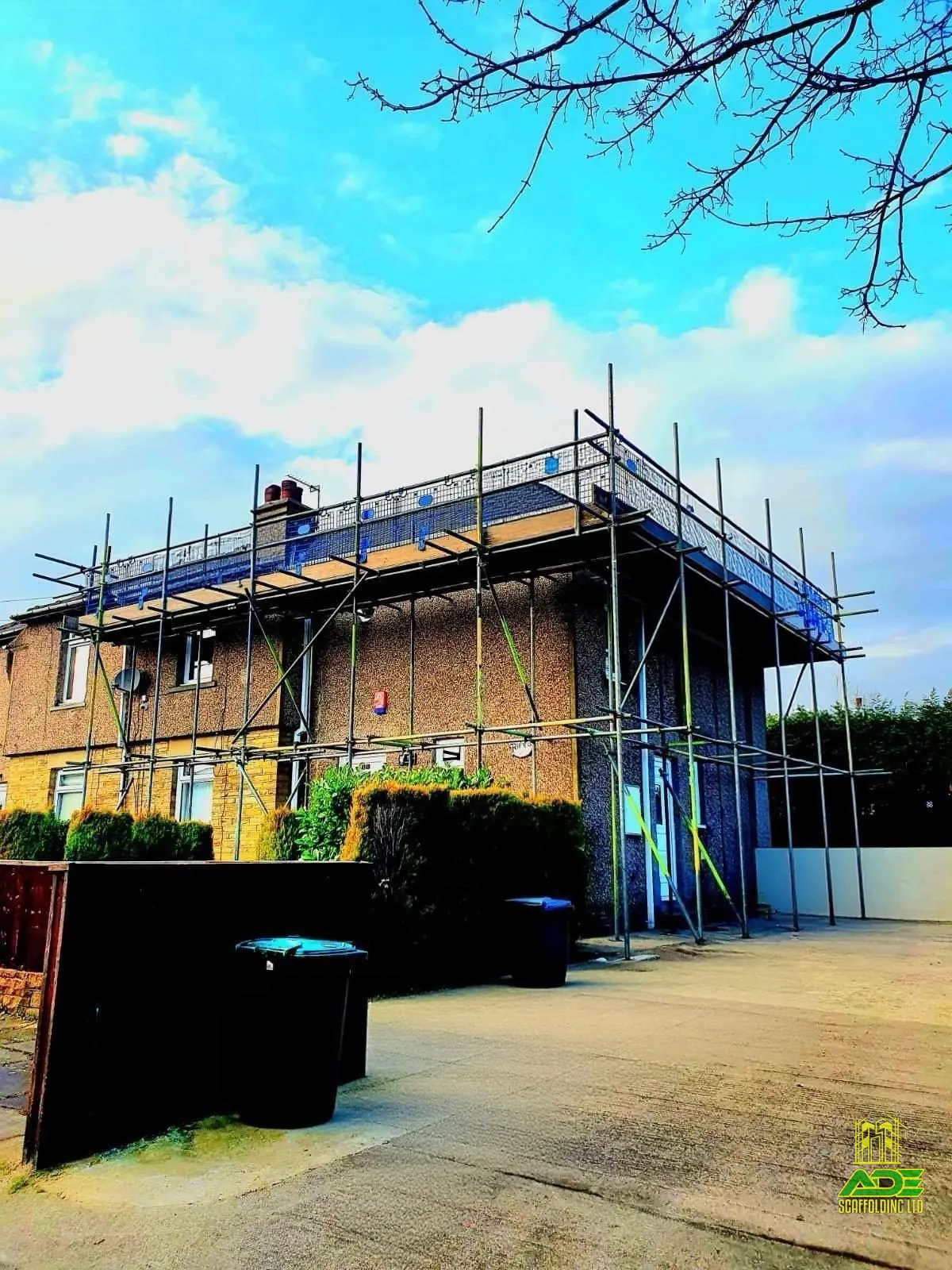 Wraparound scaffold on a rendered semi, front and side elevations